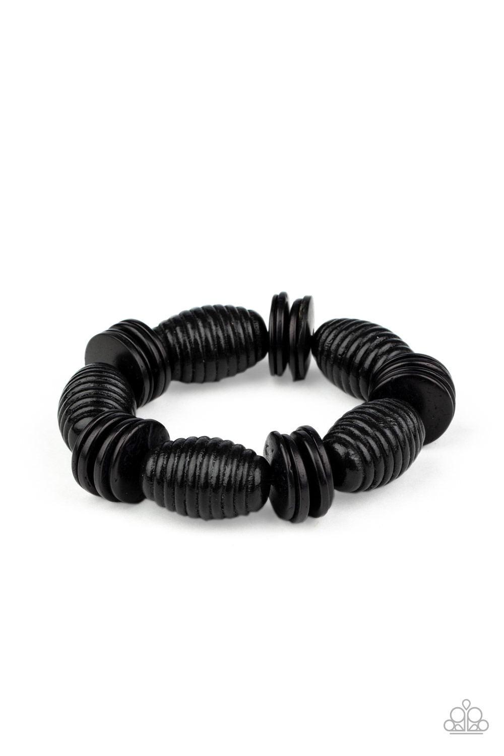 Paparazzi Accessories Caribbean Castaway - Black A summery collection of oversized black wooden beads and distressed black wooden discs are delicately threaded along stretchy bands around the wrist for a beach inspired fashion. Sold as one individual brac