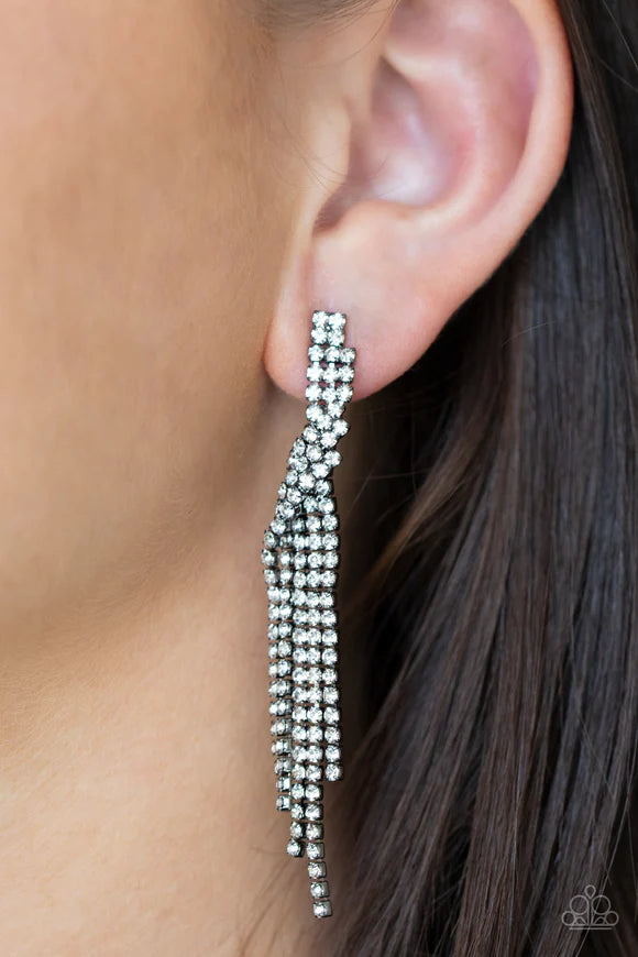 Paparazzi Accessories Cosmic Candescene - Black Encased in glistening gunmetal fittings, dainty strands of glittery white rhinestones delicately overlap into a tapered tassel for a twinkly look. Earring attaches to a standard post fitting. Sold as one pai