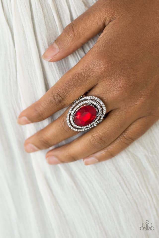 Paparazzi Accessories Making History - Red A glittery red gem sits atop stacked silver frames radiating with glassy white rhinestones for a timeless look. Features a stretchy band for a flexible fit. Sold as one individual ring. Jewelry