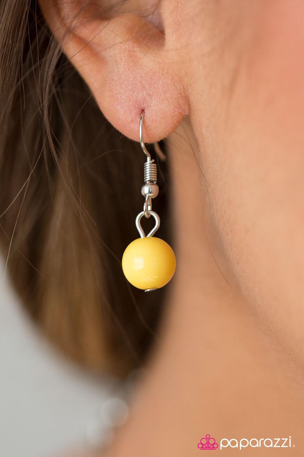 Paparazzi Accessories Glam Theory - Yellow Two rows of polished yellow beads and shimmery silver hoops drape below the collar in glamorous layers. Features an adjustable clasp closure. Jewelry