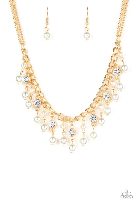 Paparazzi Accessories Regal Refinement - Gold Alternating with glassy white rhinestones, pearly white beaded tassels swing from the bottom of a shimmery gold chain below the collar for a refined flair. Features an adjustable clasp closure. Sold as one ind