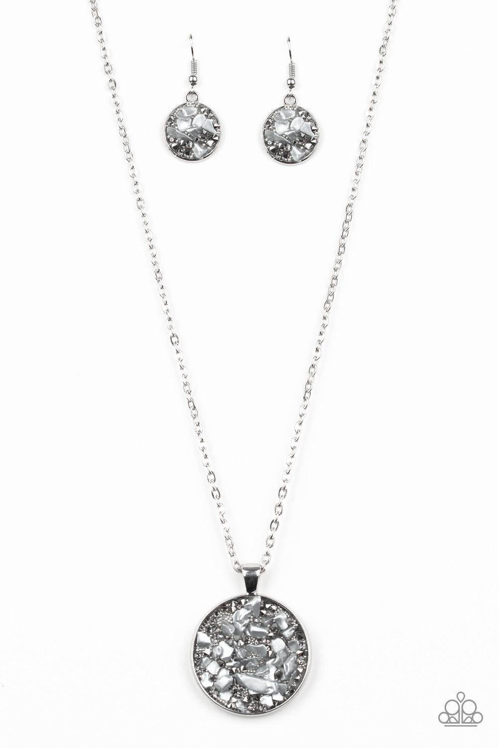 Paparazzi Accessories GLAM Crush Monday - Silver Infused with smoky and glassy rhinestone prisms, bits of metallic rock and dainty silver beads are sprinkled along the center of a round silver frame, creating a glittering pendant below the collar. Feature