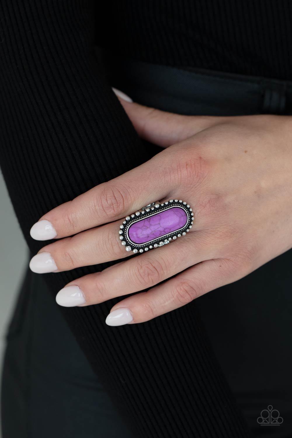 Paparazzi Accessories Sedona Scene ~Purple An oblong purple stone is nestled inside an oversized studded silver frame, creating a colorfully rustic centerpiece atop the finger. Features a stretchy band for a flexible fit. Rings