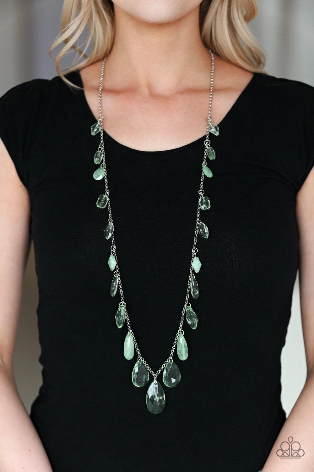 Paparazzi Accessories Glow And Steady Wins The Race - Green A gorgeous collection of glassy and cloudy green crystal-like beads trickle along a shimmery silver chain down the chest in a whimsical fashion. Features an adjustable clasp closure. Jewelry