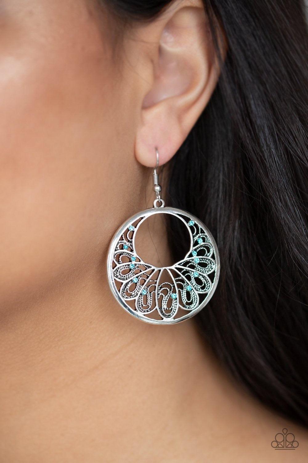 Paparazzi Accessories Fancy That - Blue Dainty blue rhinestones are sprinkled along a shimmery silver frame swirling with filigree filled petals for a whimsical look. Earring attaches to a standard fishhook fitting. Jewelry