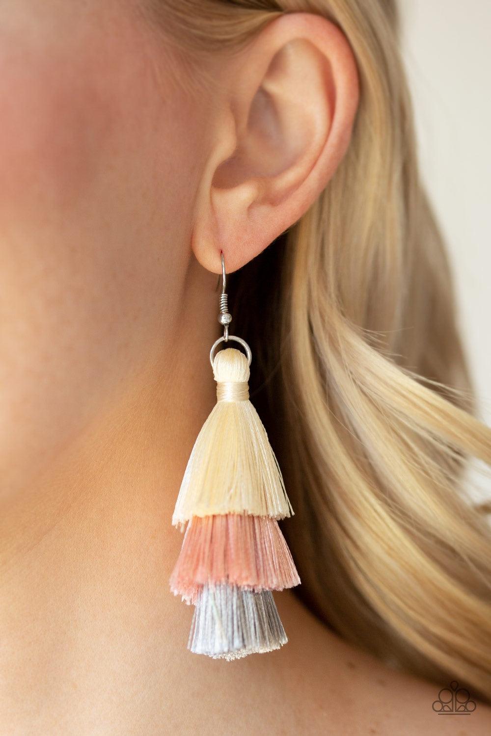 Paparazzi Accessories Hold On To Your Tassel! - Pink Featuring white, pink, and gray thread, a 3-tiered tassel swings from the ear for a flirtatious look. Earring attaches to a standard fishhook fitting. Jewelry