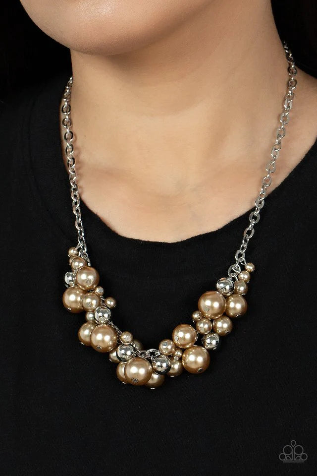 Paparazzi Accessories Classical Culture - Brown An effervescent collection of bubbly brown pearls and shiny silver beads delicately cluster along the center of an ornate silver chain, creating a classic fringe below the collar. Features an adjustable clas