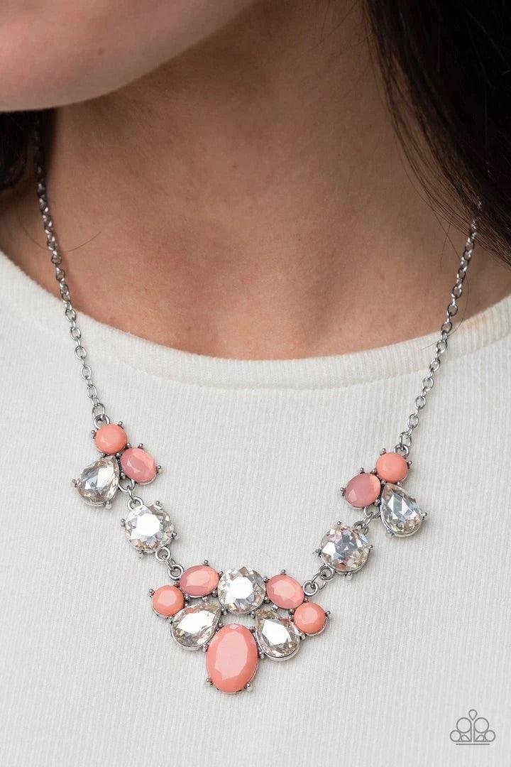 Paparazzi Accessories Ethereal Romance - Orange Varying in opacity and shape, mismatched pink beads attach to oversized white rhinestones, creating bubbly frames that delicately link into an ethereal display below the collar. Features an adjustable clasp