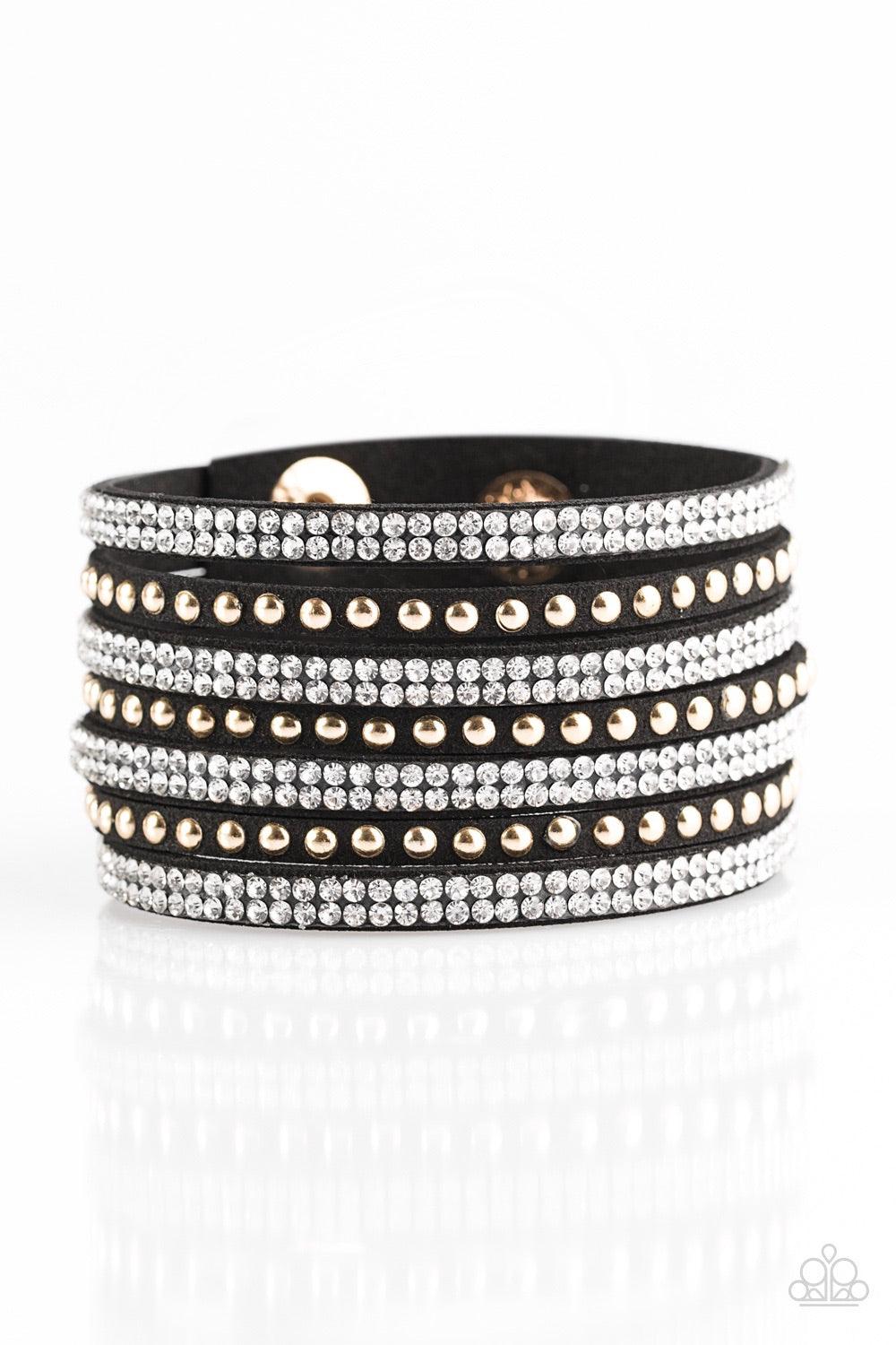 Paparazzi Accessories Victory Shine - Black Shiny gold studs and rows of glittery white rhinestones are encrusted along strips of black suede, creating sassy shimmer around the wrist. Features an adjustable snap closure. Jewelry