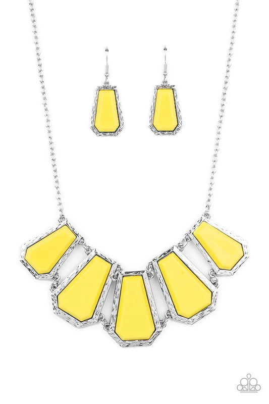 Paparazzi Accessories Stellar Heiress - Yellow Encased in hammered silver fittings, trapezoidal Illuminating acrylic frames delicately fan out below the collar for a dramatic pop of color. Features an adjustable clasp closure. Sold as one individual neckl