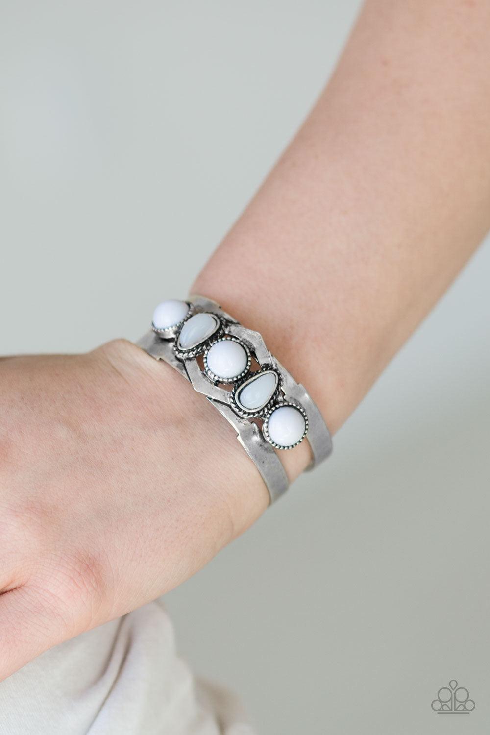 Paparazzi Accessories Keep On TRIBE-ing - Silver Featuring glassy and polished surfaces, shiny white and gray beads are pressed across the center of a silver cuff for a tribal inspired look. Sold as one individual bracelet. Jewelry