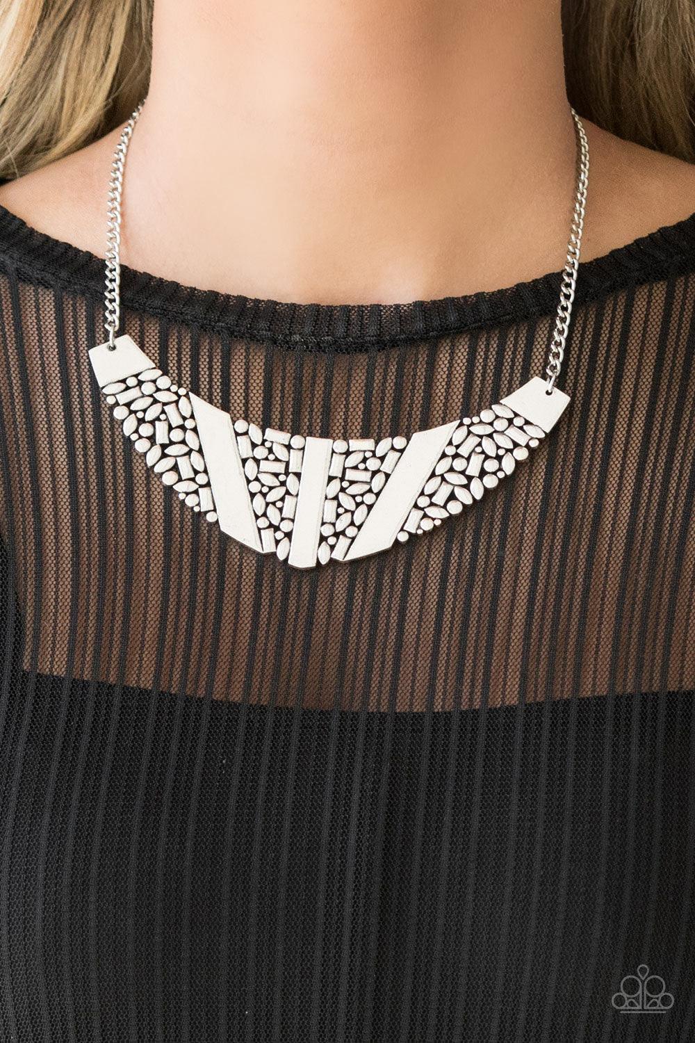 Paparazzi Accessories Terra Trailbreaker - Silver Varying in shape, a collection of dainty silver frames coalesce into a striking crescent pendant below the collar for a statement making look. Features an adjustable clasp closure. Sold as one individual n