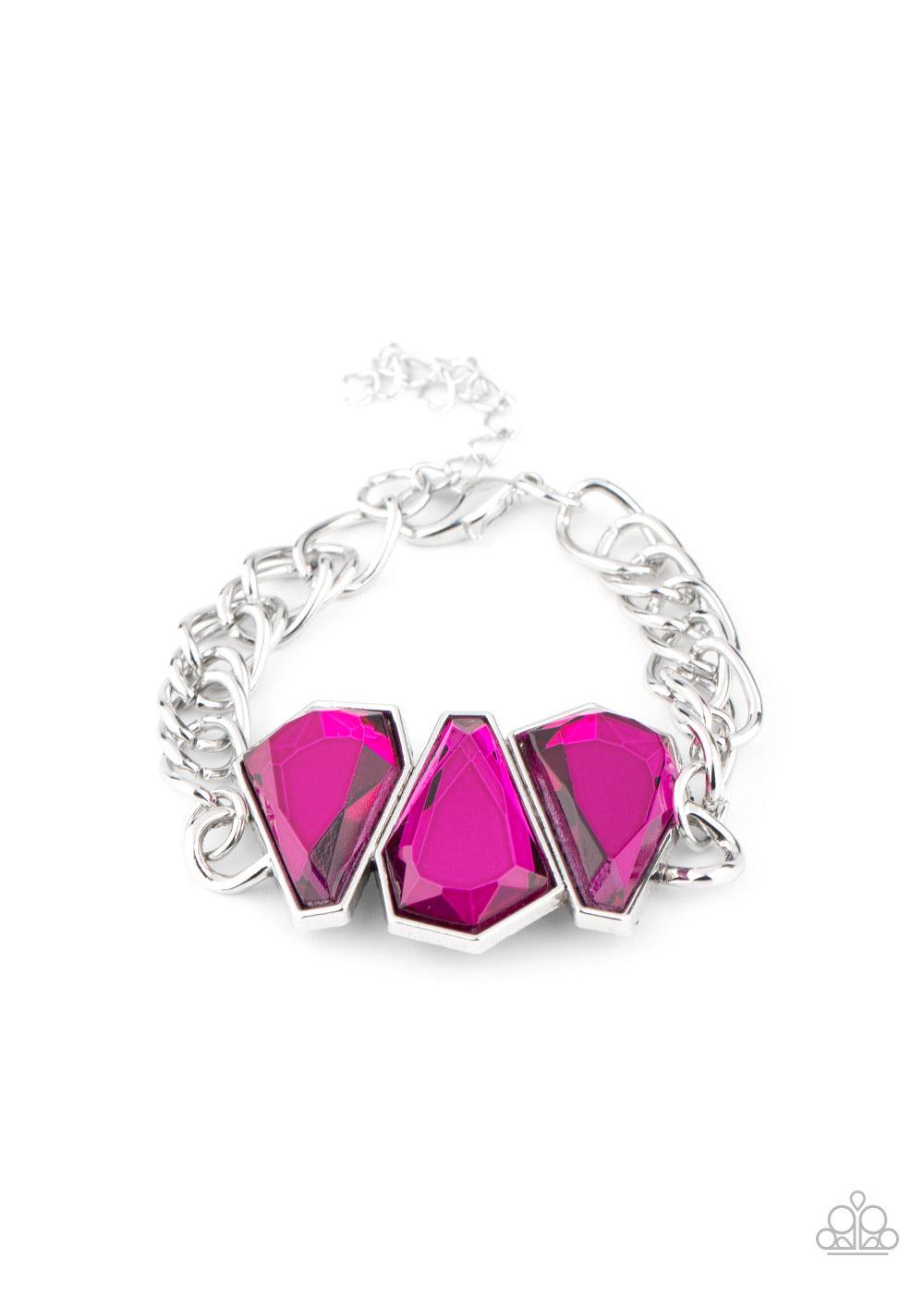 Paparazzi Accessories Raw Radiance - Pink Attached to a shiny silver chain, a trio of sparkly Pink Peacock gem-shaped rhinestones join into a glamorous centerpiece atop the wrist. Features an adjustable clasp closure. Sold as one individual bracelet. Jewe