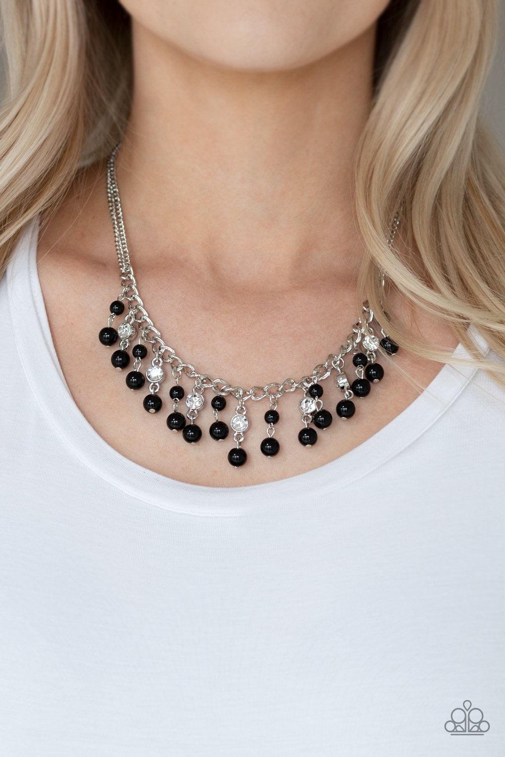 Paparazzi Accessories Regal Refinement - Black Alternating with glassy white rhinestones, shiny black beaded tassels swing from the bottom of a shimmery silver chain below the collar for a refined flair. Features an adjustable clasp closure. Sold as one i