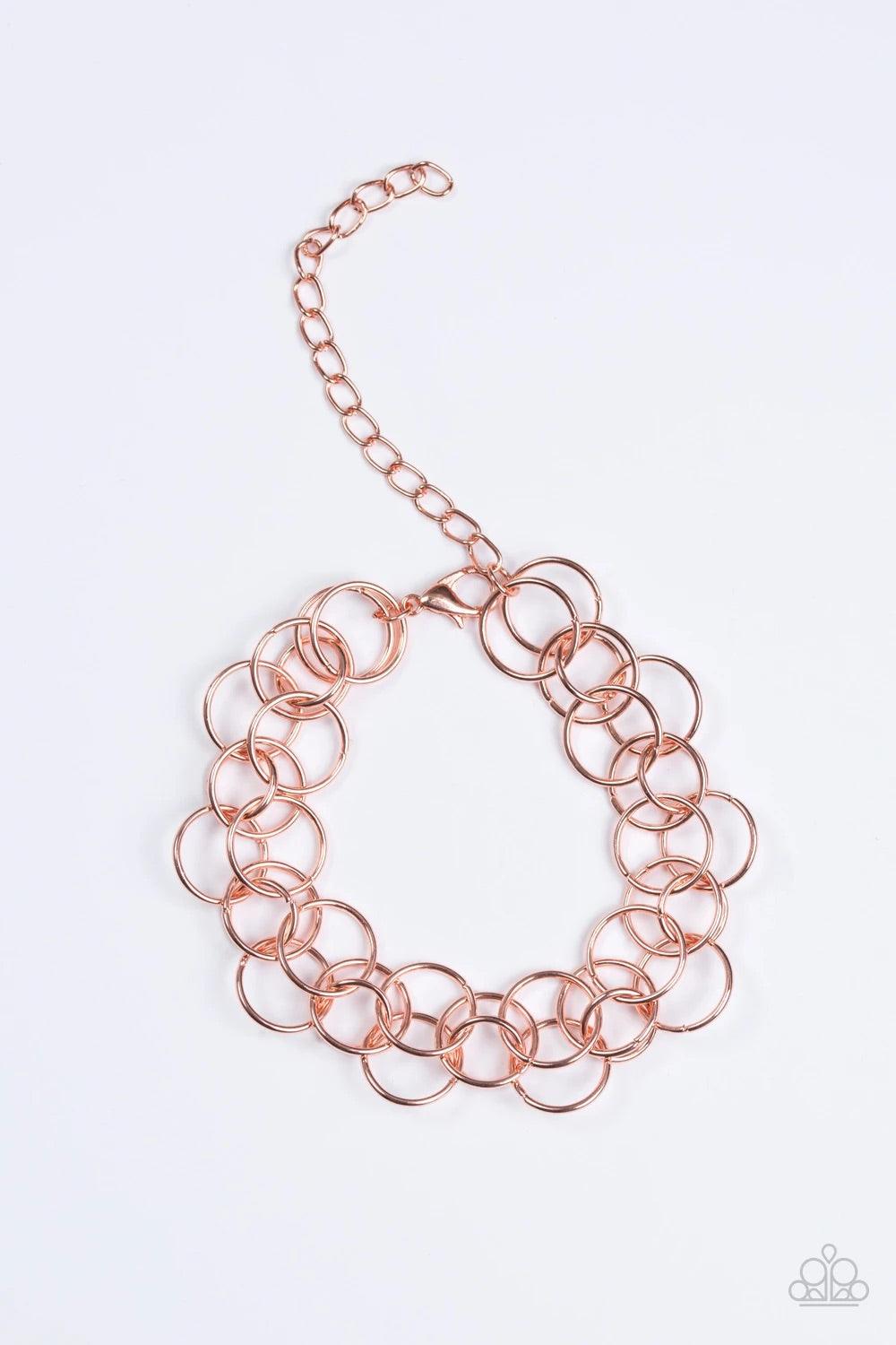 Paparazzi Accessories Contemporary Circus - Copper Varying in size, rows of shiny copper rings interlock across the wrist for a bold industrial look. Features an adjustable clasp closure. Sold as one individual bracelet. Jewelry