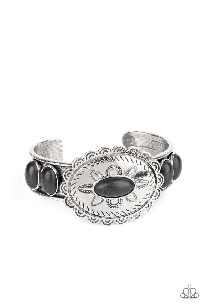 Paparazzi Accessories Canyon Heirloom - Black Dotted with an earthy black stone, a floral stamped scalloped silver frame sits atop a black stone studded silver cuff, creating a southwestern inspired buckle atop the wrist. Sold as one individual bracelet.