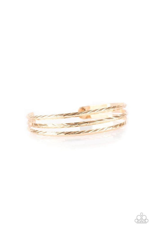 Paparazzi Accessories Eastern Empire - Gold Etched in shimmery geometric patterns, glistening gold bars arc across the wrist, coalescing into a dainty cuff. Sold as one individual bracelet. Jewelry