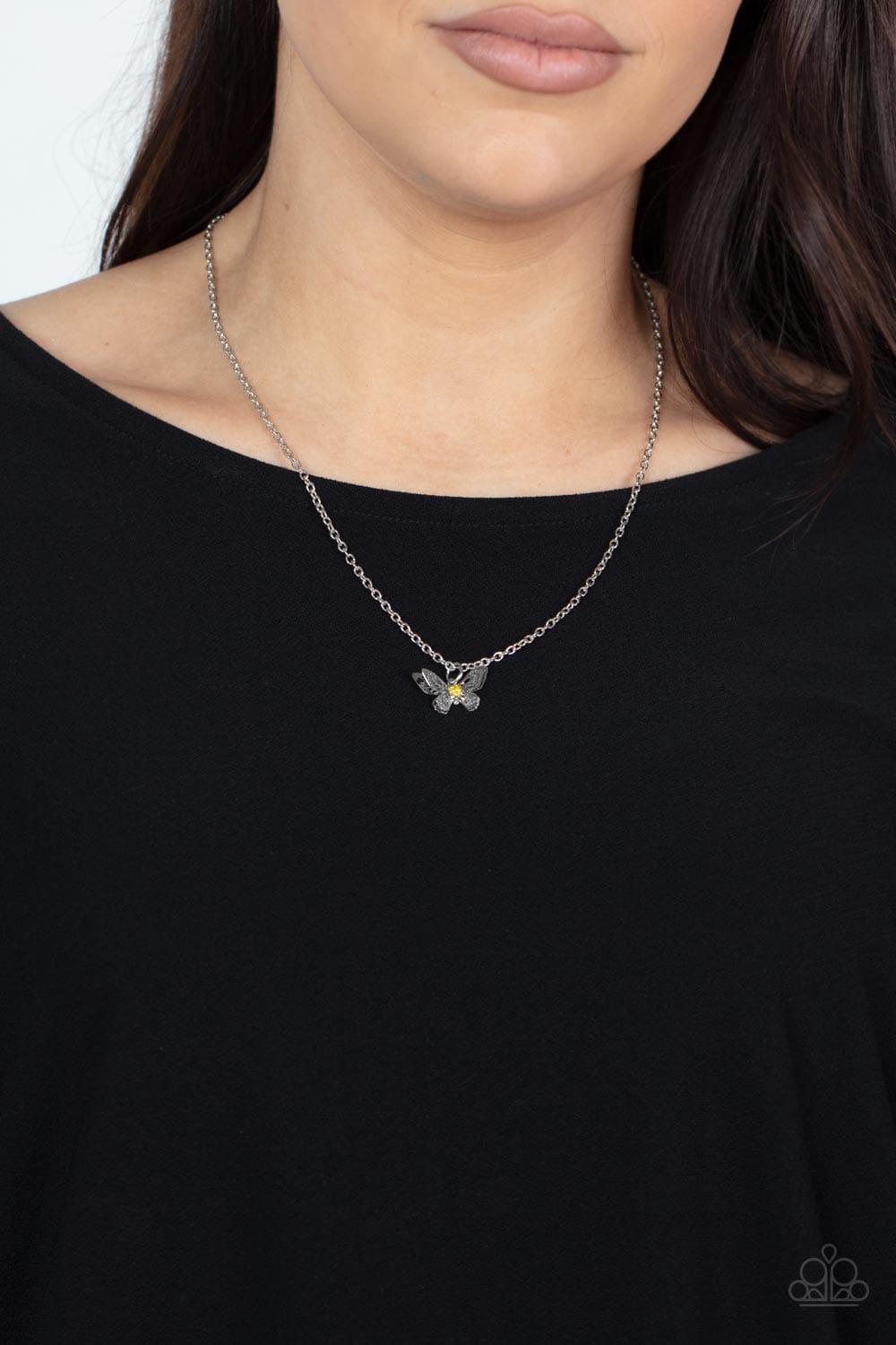 Paparazzi Accessories Flutter Love - Yellow Layered with ornate silver wings, a yellow rhinestone dotted butterfly flutters from a dainty silver chain below the collar for a whimsical fashion. Features an adjustable clasp closure. Sold as one individual n