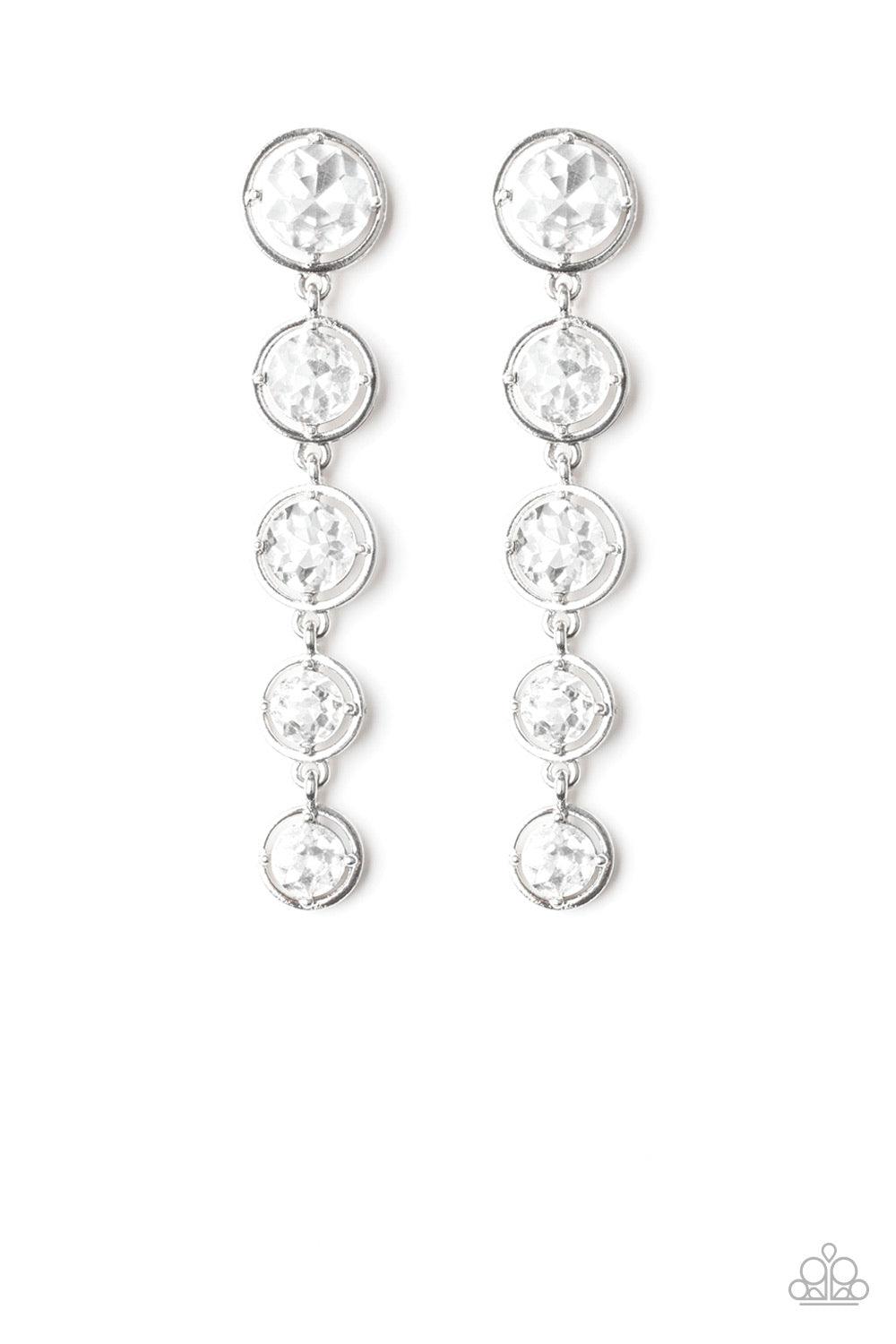 Paparazzi Accessories Drippin In Starlight - White Featuring sleek silver fittings, faceted white gems gradually decrease as they trickle from the ear for a glamorous look. Earring attaches to a standard post fitting. Jewelry