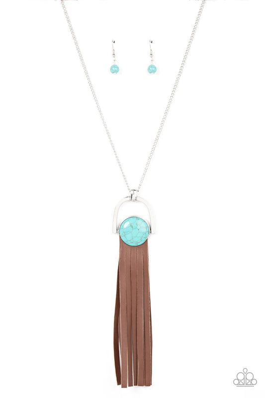 Paparazzi Accessories Winslow Wanderer - Blue Strips of brown leather fan out from the bottom of a round turquoise stone that is threaded along a metal rod that attaches to the bottom of a silver horseshoe frame. The earthy pendant swings from the bottom