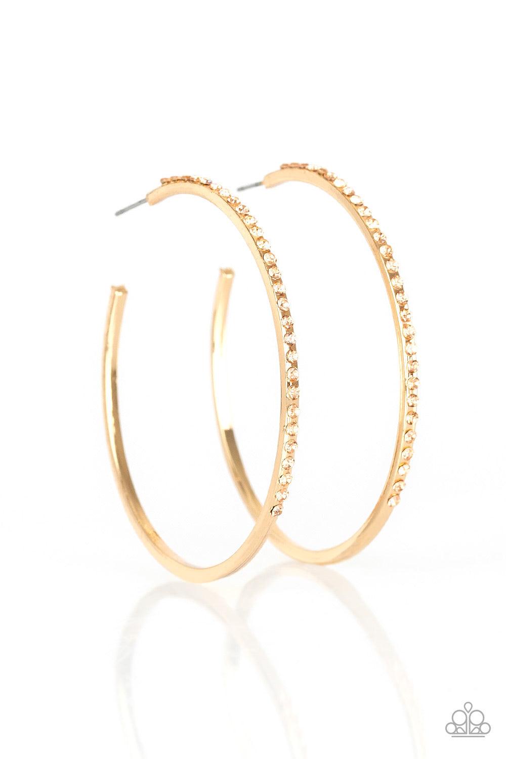 Paparazzi Accessories Trending Twinkle - Gold The front half of a gold hoop is encrusted in peach rhinestones for a radiant look. Earring attaches to a standard post fitting. Hoop measures 2 1/4" in diameter. Jewelry