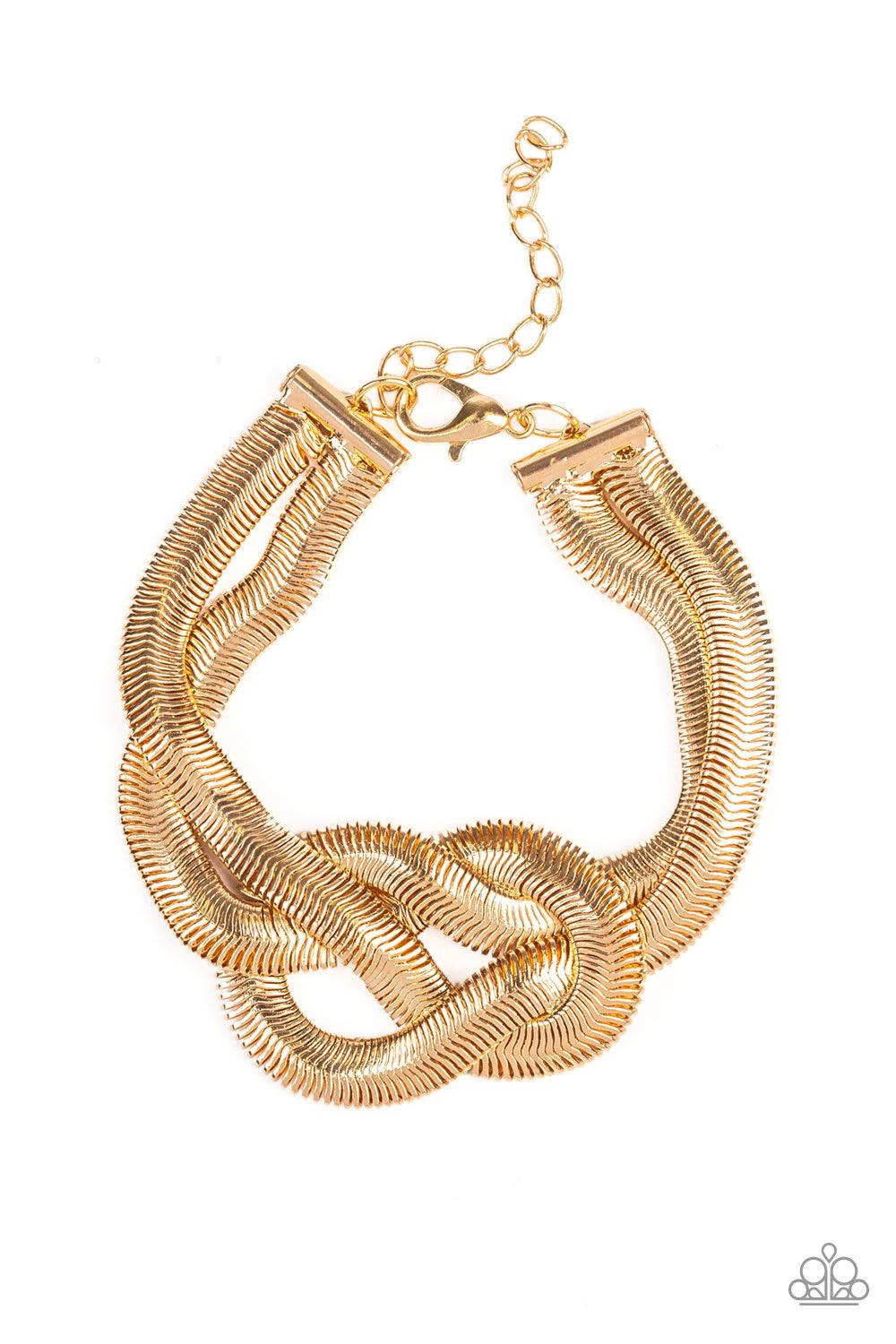 Paparazzi Accessories To The Max ~Gold Two thick rows of gold herringbone chain knot into a bold centerpiece atop the wrist. Features an adjustable clasp closure.