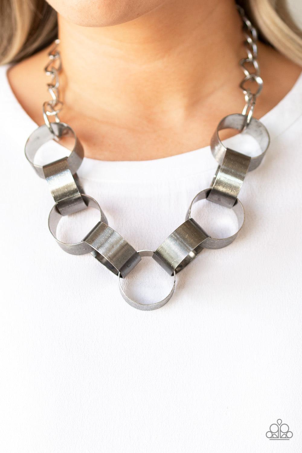 Paparazzi Accessories Big Hit - Silver Etched in linear patterns, dramatically oversized silver links connect below the collar for a bold statement-making look. Features an adjustable clasp closure. Jewelry