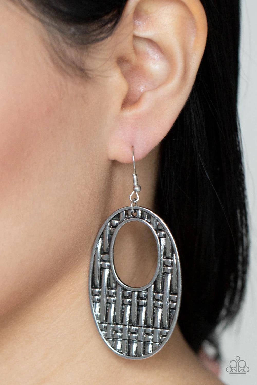 Paparazzi Accessories Engraved Edge - Silver Oversized antiqued silver oval cut-out frames are embossed with a bold basket weave design resulting in a dramatic statement making finish. Earring attaches to a standard fishhook fitting. Sold as one pair of e