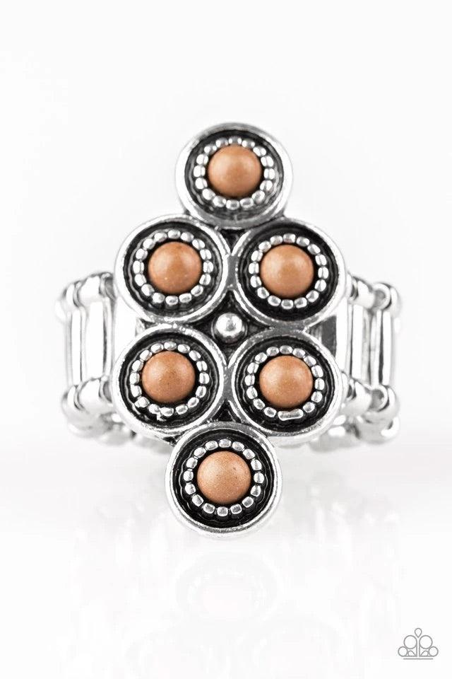 Paparazzi Accessories River Rock Rhythm - Brown Dainty brown stones are pressed into ornate silver frames, coalescing into an earthy frame atop the finger. Features a stretchy band for a flexible fit. Jewelry