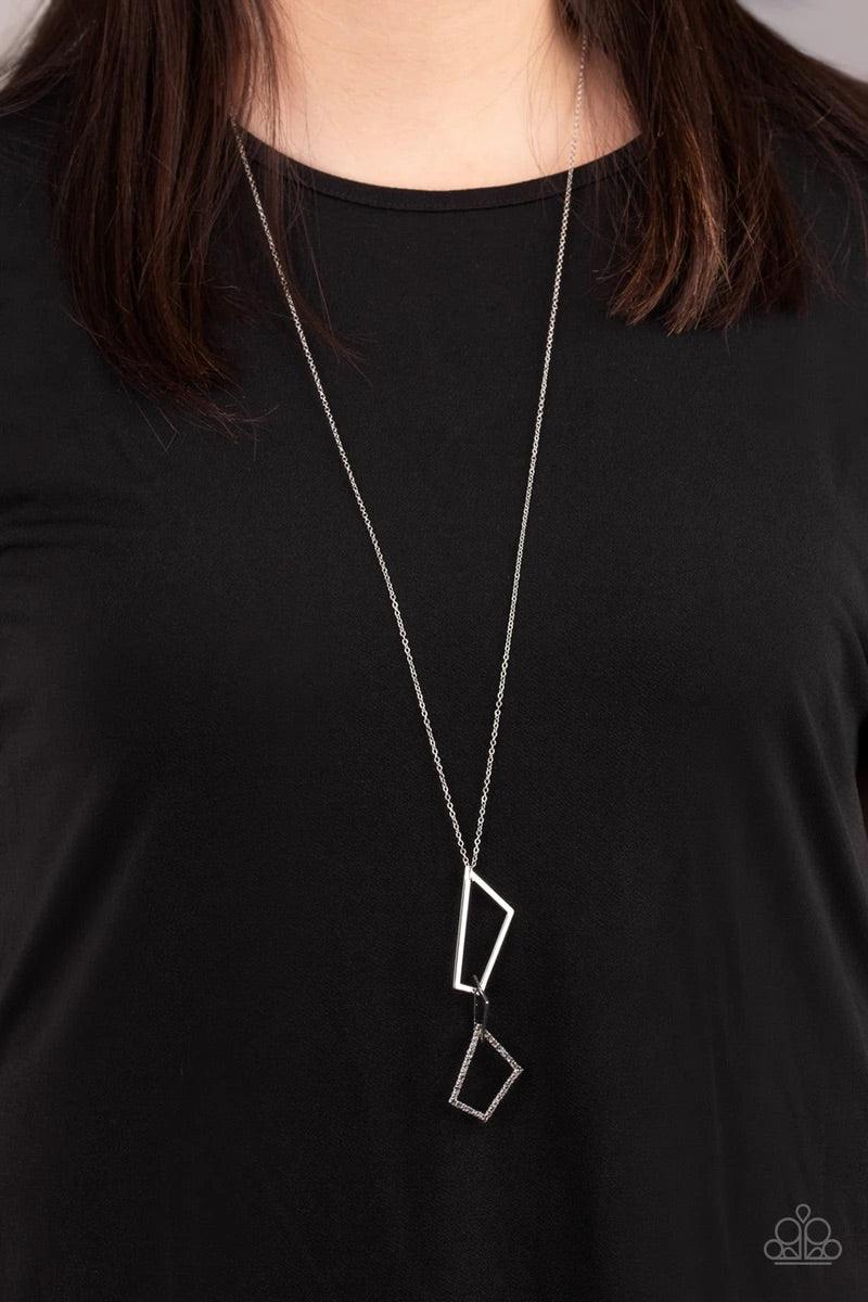 Paparazzi Accessories Shapely Silhouette - Silver A mismatched collection of smoky rhinestone encrusted and silver trapezoid frames connect at the bottom of a lengthened silver chain, creating an abstract pendant. Features an adjustable clasp closure. Sol