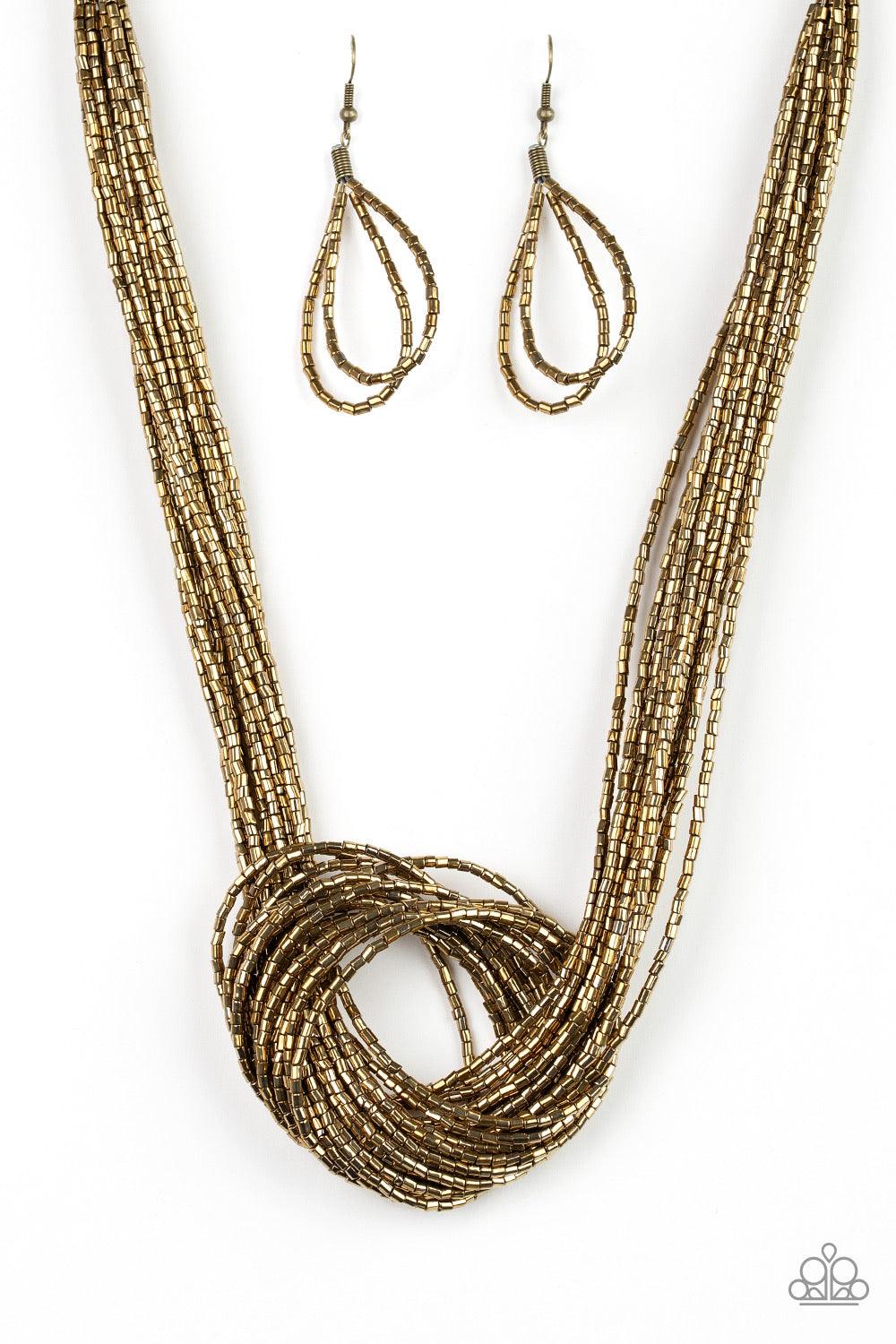 Paparazzi Accessories Knotted Knockout - Brass Countless strands of brass seed beads delicately knot together below the collar to create an unforgettable statement piece. Features an adjustable clasp closure. Sold as one individual necklace. Includes one