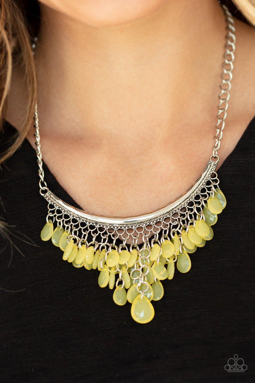 Paparazzi Accessories Rio Rainfall - Yellow Varying in size, opaque yellow teardrops drip from the bottom of a bowing silver bar, creating an effervescent fringe below the collar. Features an adjustable clasp closure. Sold as one individual necklace. Incl