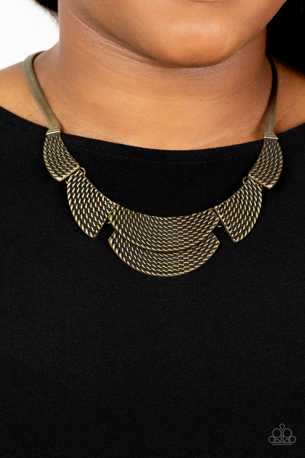 Paparazzi Accessories Empress Empire - Brass Embossed in raised metallic stitched-like textures, curved brass plates boldly fan out from an oversized brass snake chain below the collar for a fearless fashion. Features an adjustable clasp closure. Sold as