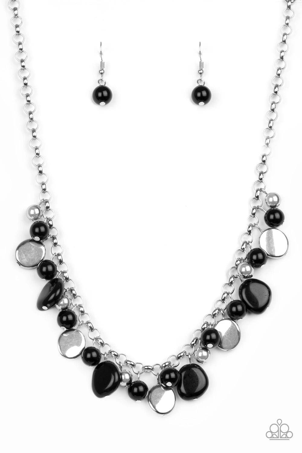 Paparazzi Accessories Flirtatiously Florida - Black Featuring round and asymmetrical shapes, shiny silver and black beads swing from the bottom of a bold silver chain, creating a flirtatious fringe below the collar. Features an adjustable clasp closure. S