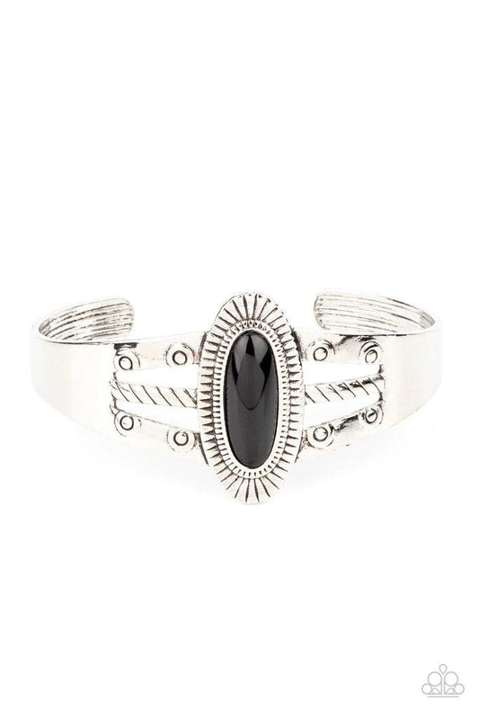 Paparazzi Accessories Wanderlust Walkabout - Black An oval black bead is pressed into the center of a textured silver frame atop a layered silver cuff stamped in swirly texture, resulting in a trendy pop of color around the wrist. Sold as one individual b