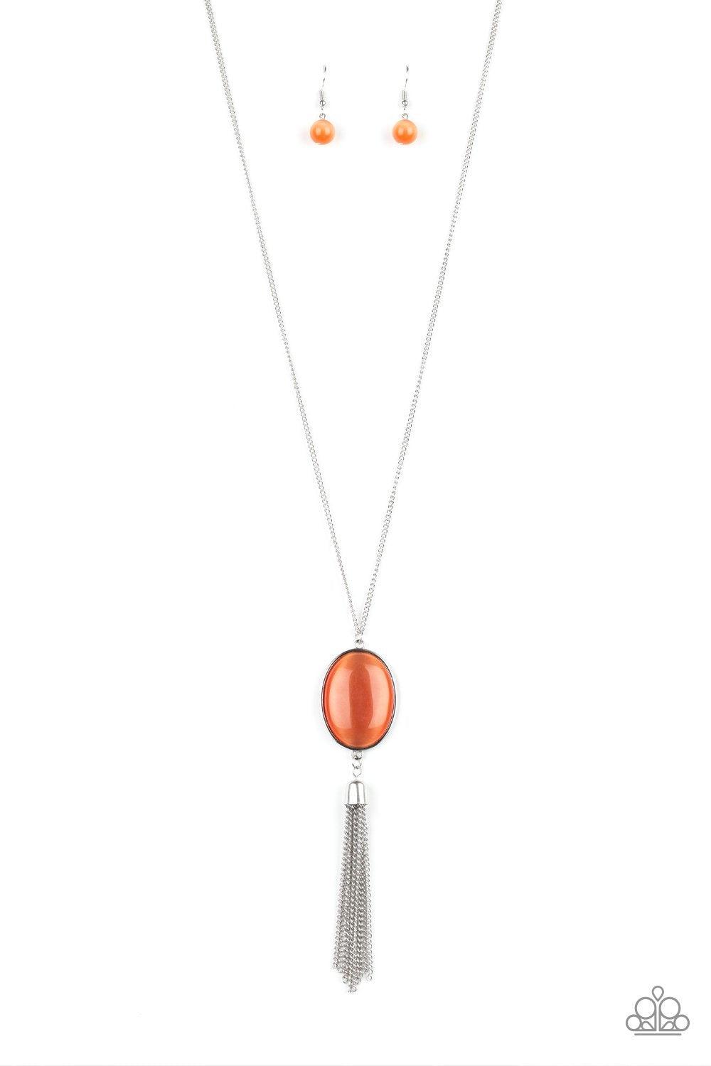 Paparazzi Accessories Tasseled Tranquility - Orange An oversized orange cat's eye stone frame gives way to a shimmery silver chain tassel, creating a whimsically stacked pendant at the bottom of a lengthened silver chain. Features an adjustable clasp clos