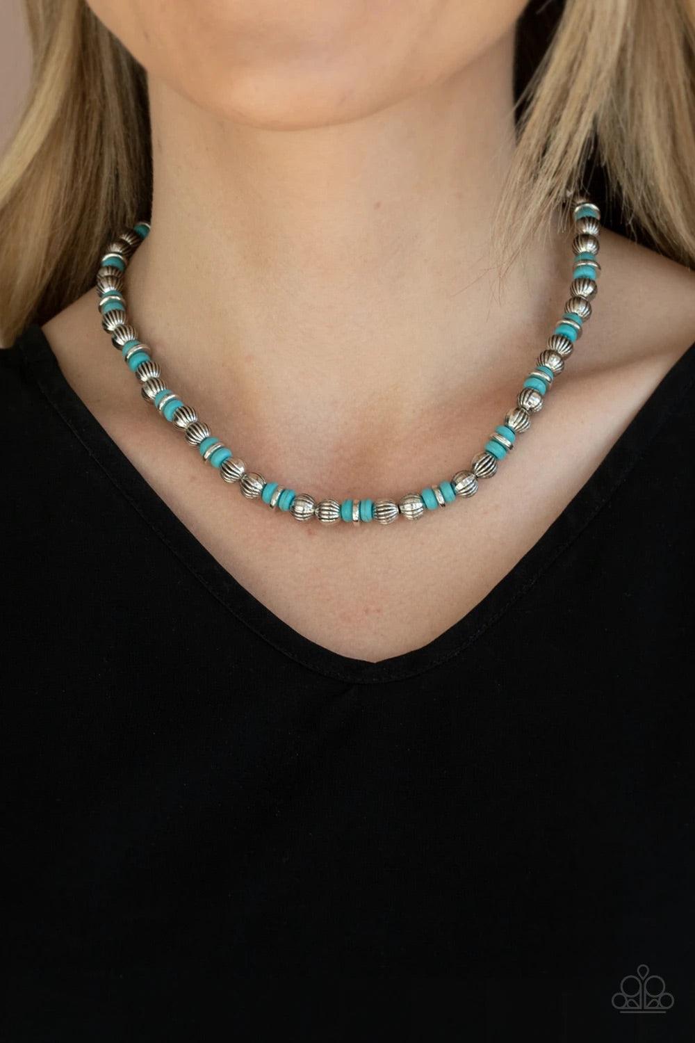 Paparazzi Accessories ZEN You Least Expect It ~Blue A rustic collection of silver discs, ornate silver beads, and refreshing turquoise stones are threaded along an invisible wire below the collar for a seasonal look. Features an adjustable clasp closure.