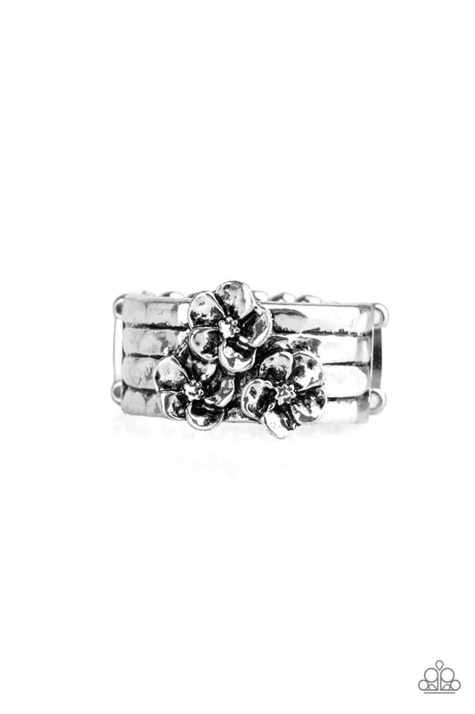 Paparazzi Accessories This ISLAND Is Your ISLAND - Silver A trio of flowers bloom from the center of a thick silver band rippling with hammered and linear textures for a seasonal look. Features a stretchy band for a flexible fit. Sold as one individual ri