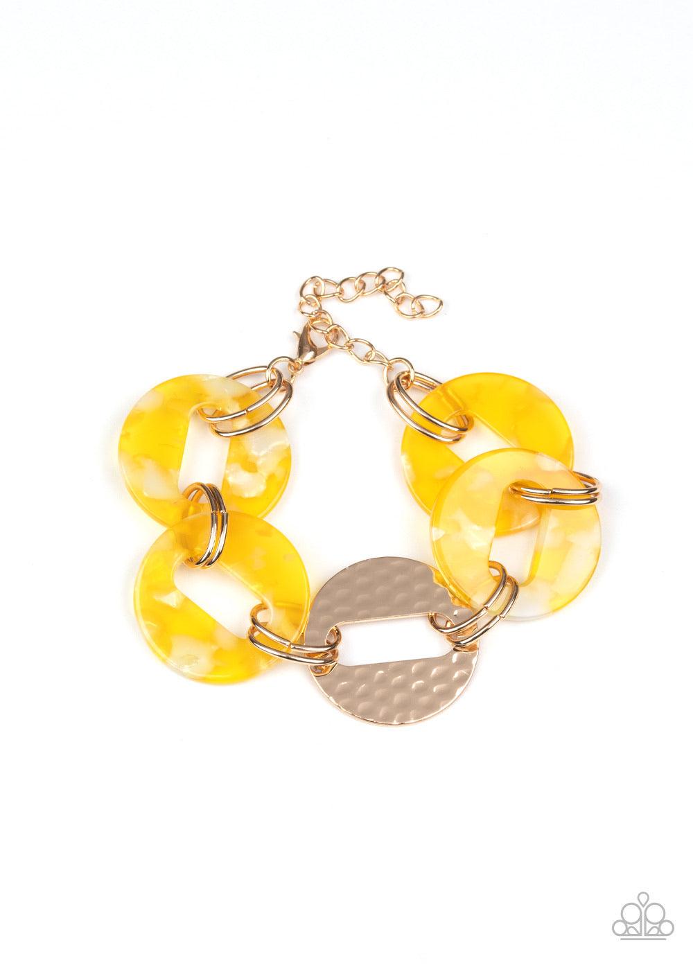 Paparazzi Accessories Retro Recharge - Yellow Featuring airy circular shapes, hammered gold frames link with shiny yellow acrylic frames around the wrist for a colorfully retro look. Features an adjustable clasp closure. Sold as one individual bracelet. J