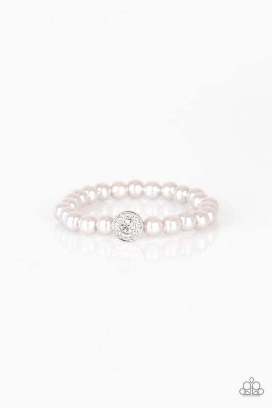 Paparazzi Accessories Follow My Lead - Silver Silver pearls and a white rhinestone encrusted silver charm are threaded along a stretchy band, creating a glamorous centerpiece atop the wrist. Sold as one individual bracelet. Jewelry