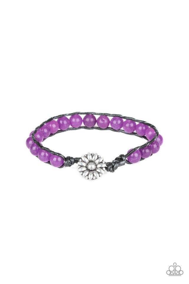 Paparazzi Accessories Daisy Guru - Purple Featuring a silver floral fitting, a collection of glassy purple stones are threaded between two strands of black cording around the wrist for a seasonal flair. Features a button loop closure. Jewelry