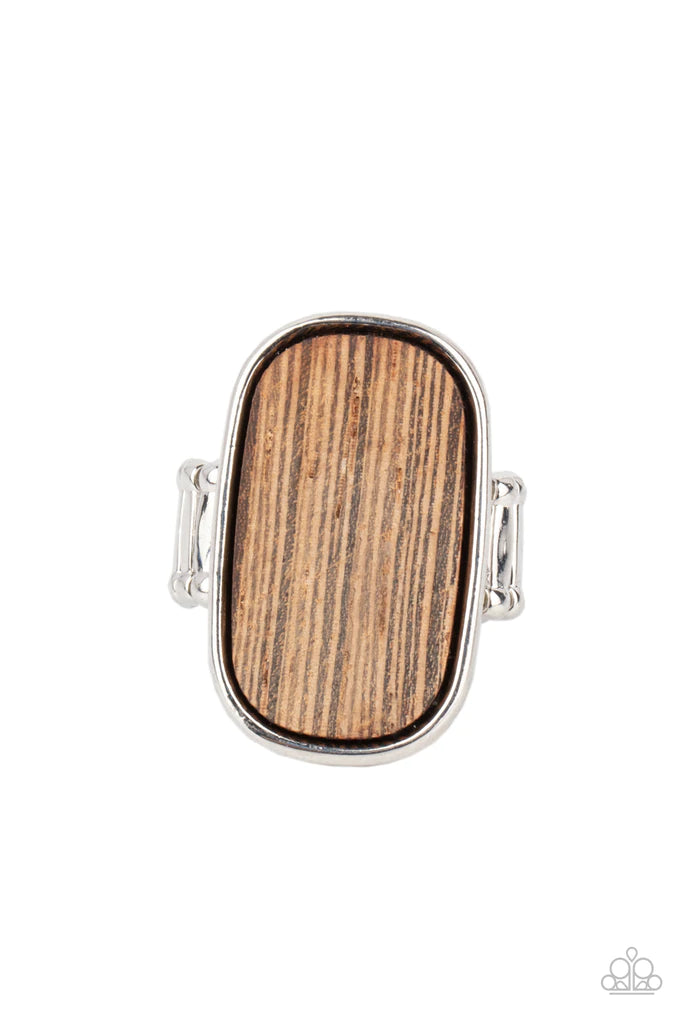 Paparazzi Accessories Reclaimed Refinement - Brown Encased in a sleek silver frame, a rustic piece of wood sits atop the finger for an unexpected refinement. Features a stretchy band for a flexible fit. Sold as one individual ring. Jewelry