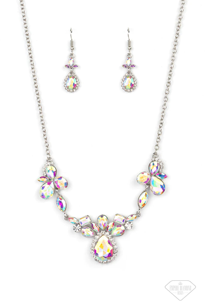 Paparazzi Accessories Intergalactic Icon - Multi Featuring emerald, oval, teardrop, and marquise style cuts, clusters of iridescent gems brilliantly sparkle below the collar for an out-of-this-world shimmer. Bordered in dainty white rhinestones, the cente