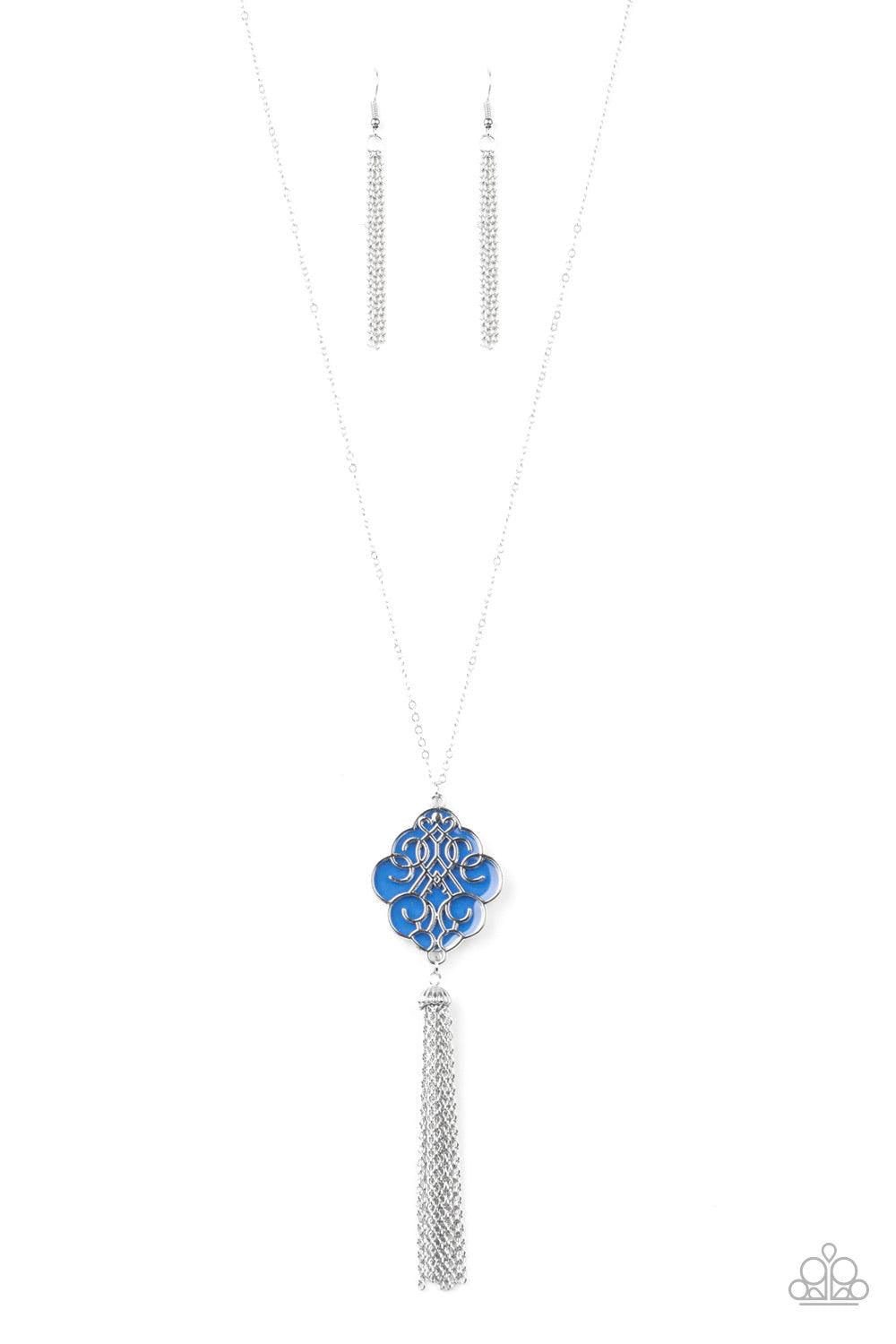 Paparazzi Accessories Malibu Mandala - Blue Shimmery silver filigree swirls across a shiny blue backdrop, coalescing into a colorful pendant. A glistening silver chain tassel swings from the bottom of the pendant for a whimsical finish. Features an adjust