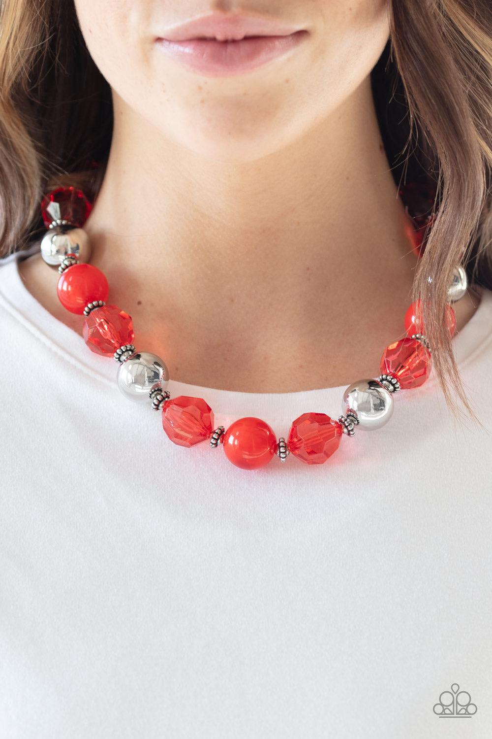 Paparazzi Accessories Very Voluminous ~Red Infused with dainty silver accents, exaggerated display of oversized silver beads, faceted red crystal-like beads, and cloudy red beads are threaded along an invisible wire below the collar for a colorfully state