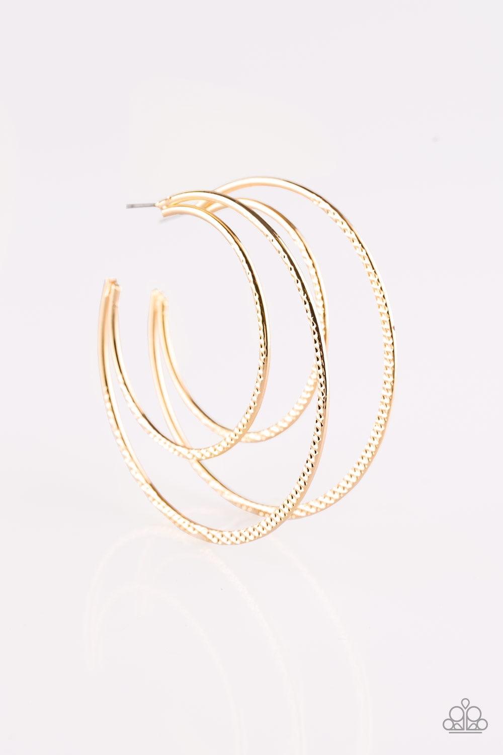 Paparazzi Accessories Drop It Like It’s HAUTE - Gold Featuring diamond-cut textures, two glistening gold bars curl into a bold hoop for a flawless finish. Earring attaches to a standard post fitting. Hoop measures 2 3/4” in diameter. Jewelry