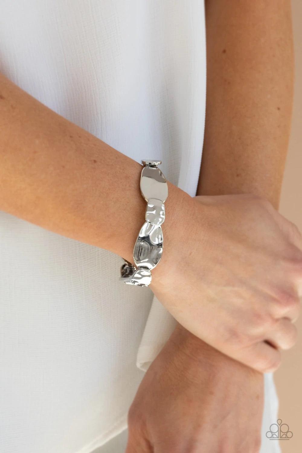 Paparazzi Accessories Absolutely Appliqué - Silver Hammered in shimmery details, asymmetrical shiny silver frames delicately overlap along stretchy bands around the wrist for an artisan inspired look. Sold as one individual bracelet. Jewelry