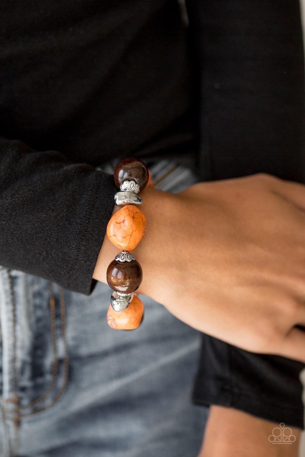 Paparazzi Accessories Gorgeously Grounded - Orange Infused with ornate silver accents, orange stones and earthy wooden beads are threaded along a stretchy elastic band for a seasonal look. Jewelry