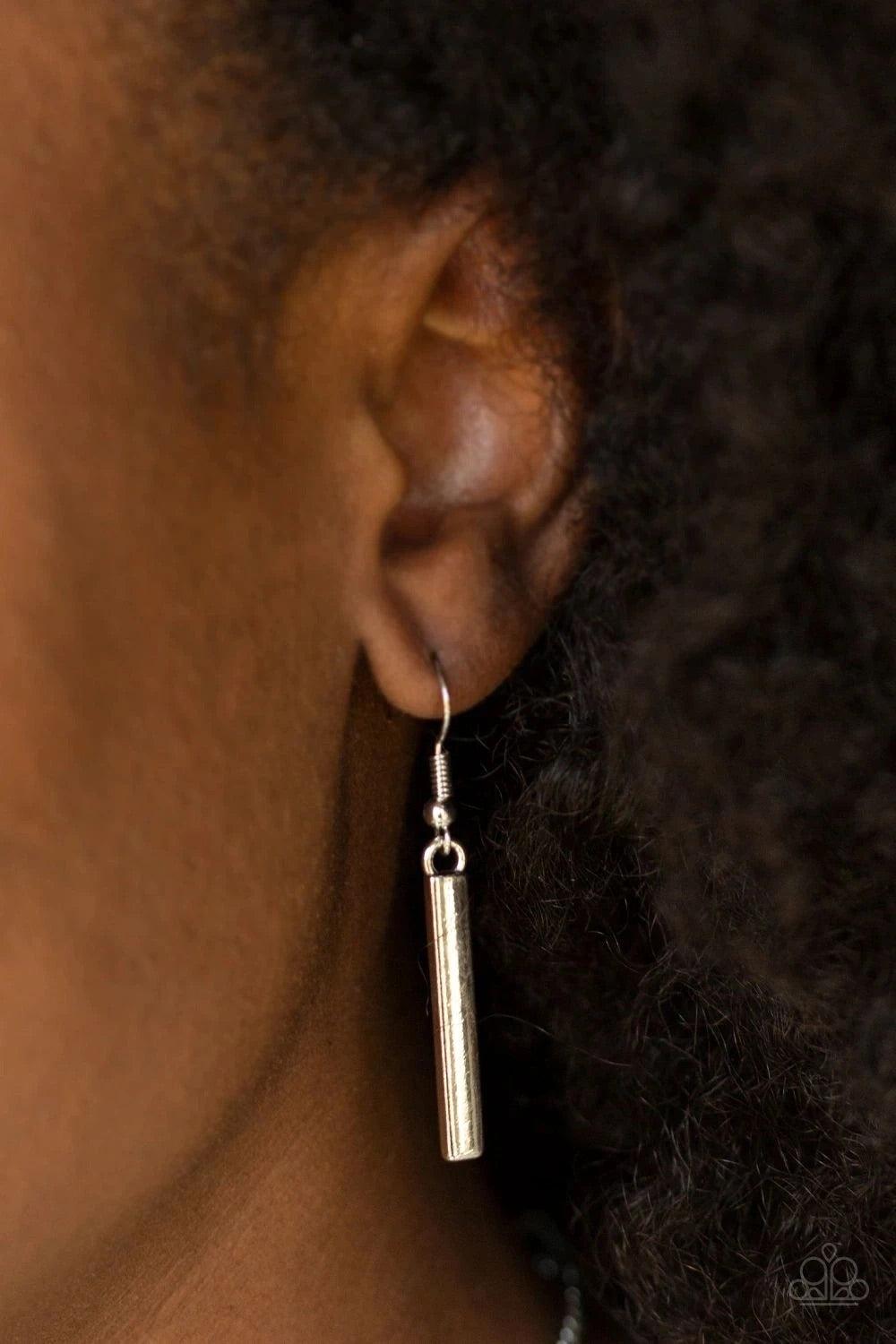 Paparazzi Accessories Confidently Cleopatra - Silver Two airy geometric silver frames link at the bottom of a lengthened silver chain, creating a stacked pendant. Rectangular bars swing from the bottom of the pendant, adding a bold movement to the tribal