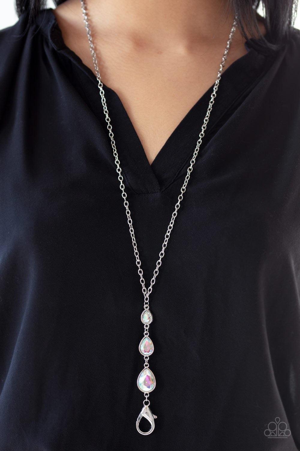 Paparazzi Accessories Don’t Mind If I Dew - Multi Featuring a rainbow iridescence, three glittery teardrop rhinestones gradually increase in size as they drip from the bottom of a lengthened silver chain. A lobster clasp hangs from the bottom of the desig